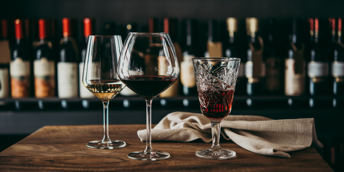 Different types of wine and spirits in ornate glasses