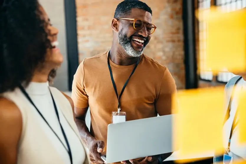 Smiling people in a stand up meeting