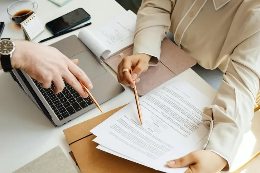 People reviewing business documents together