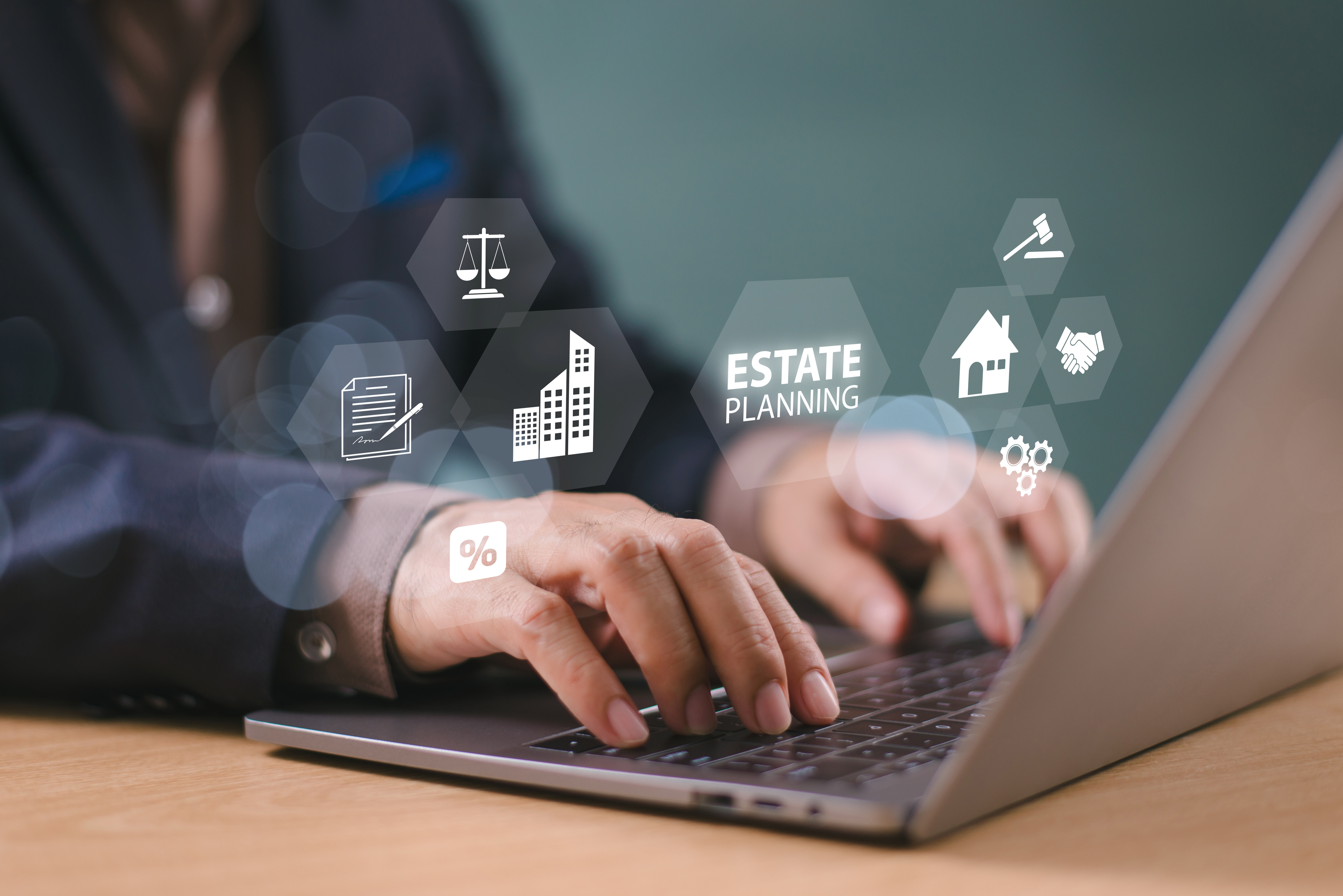 Individual on laptop searching the components of estate insurance