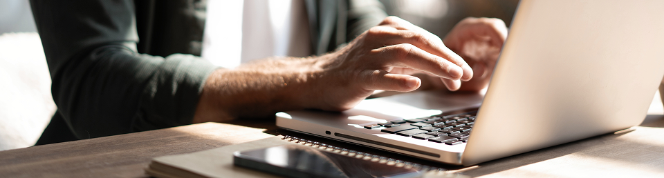 Person typing on keyboard