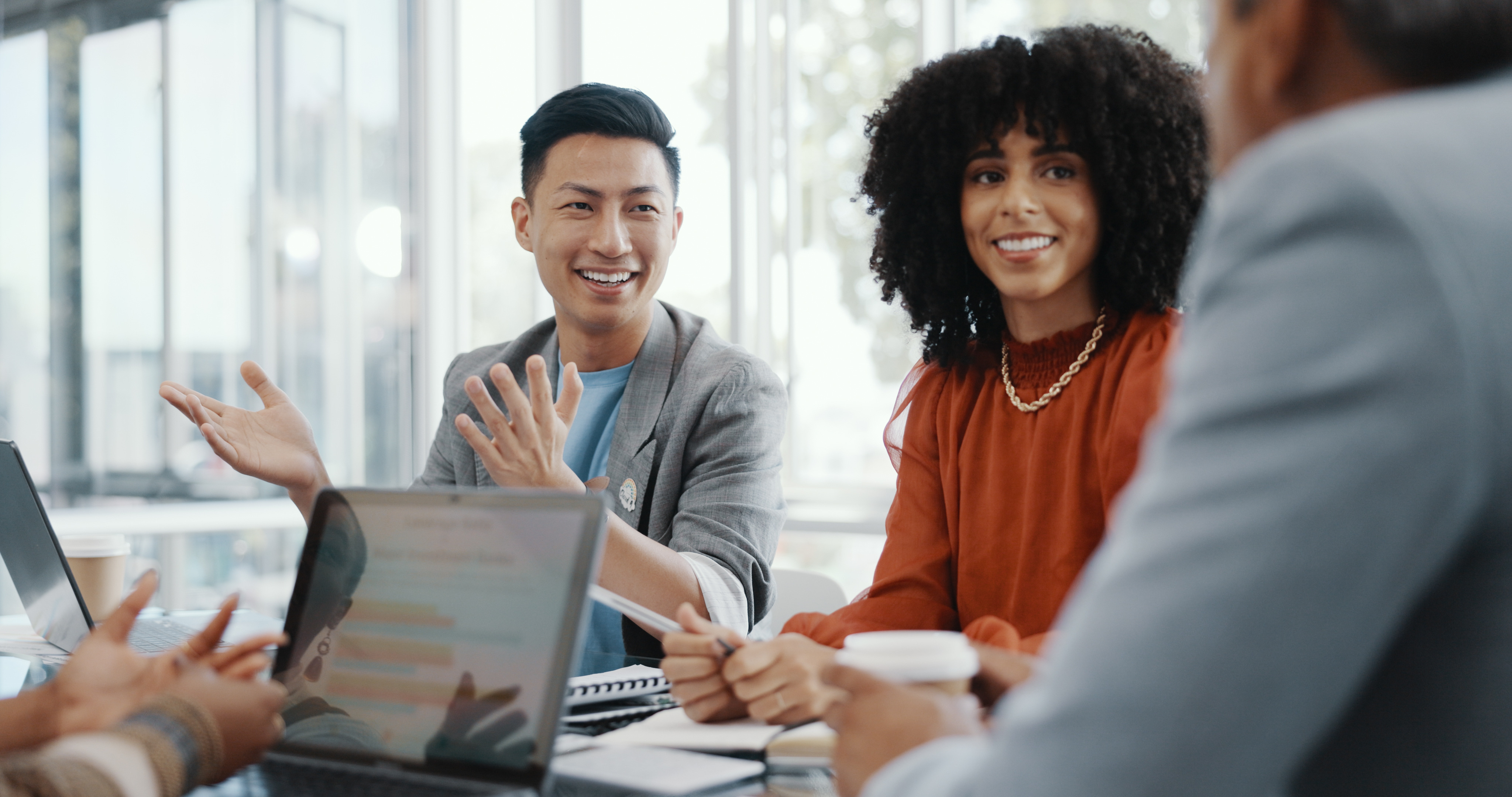 Smiling people in an office meeting